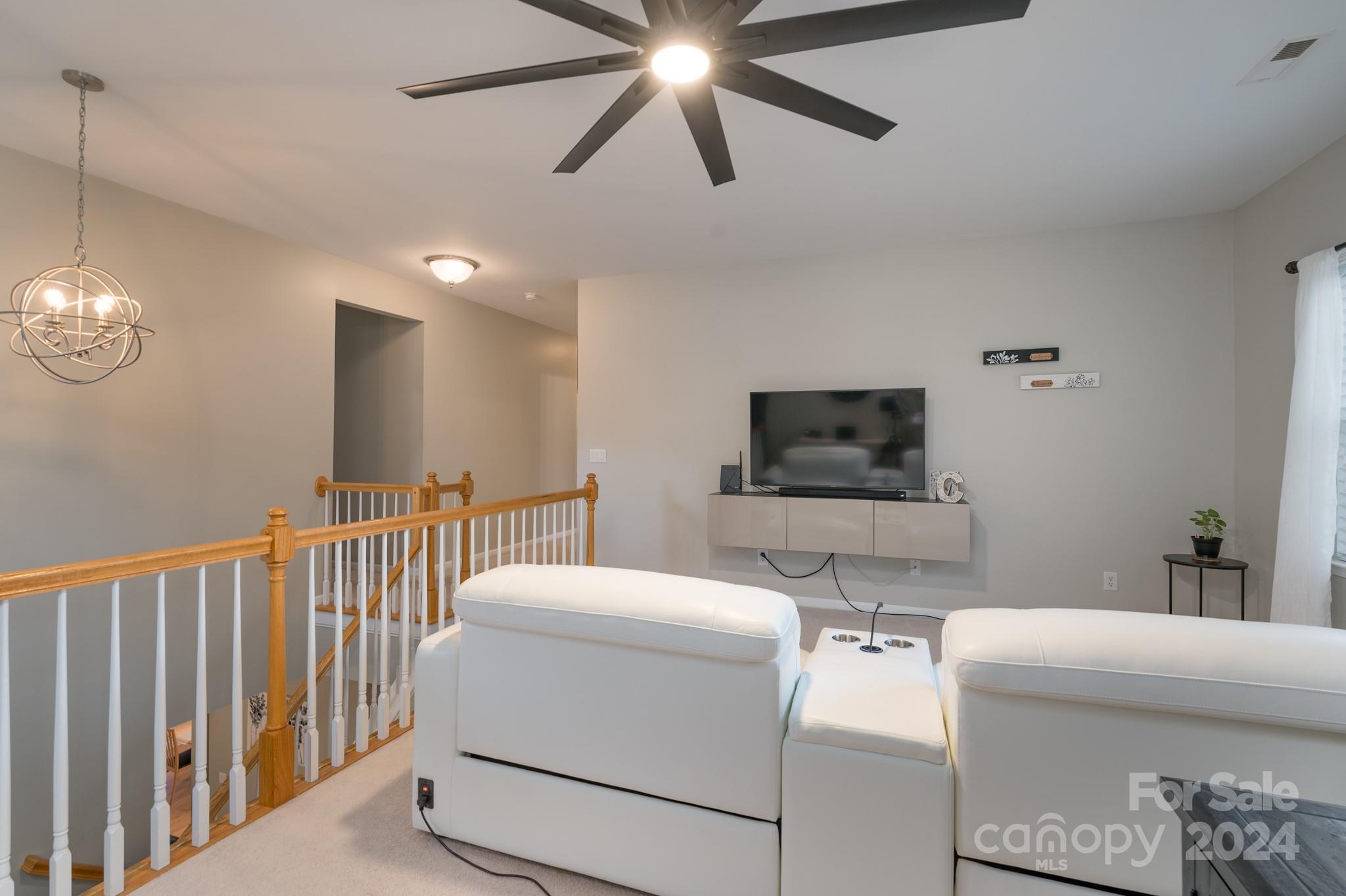 925 Treasure Court Fort Mill, SC 29708 - Photo 23 of 45 a living room with furniture and a flat screen tv