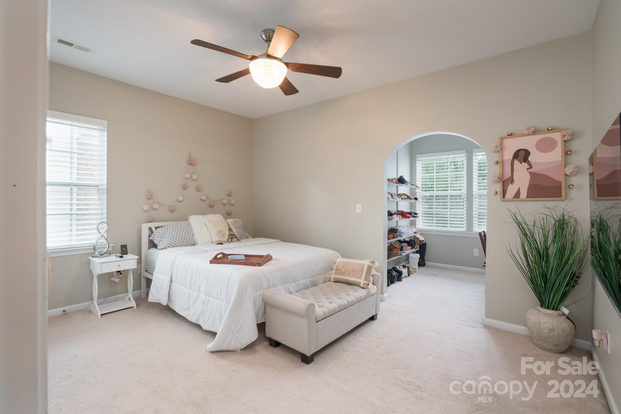 925 Treasure Court Fort Mill, SC 29708 - Photo 25 of 45 a bedroom with furniture and a large window