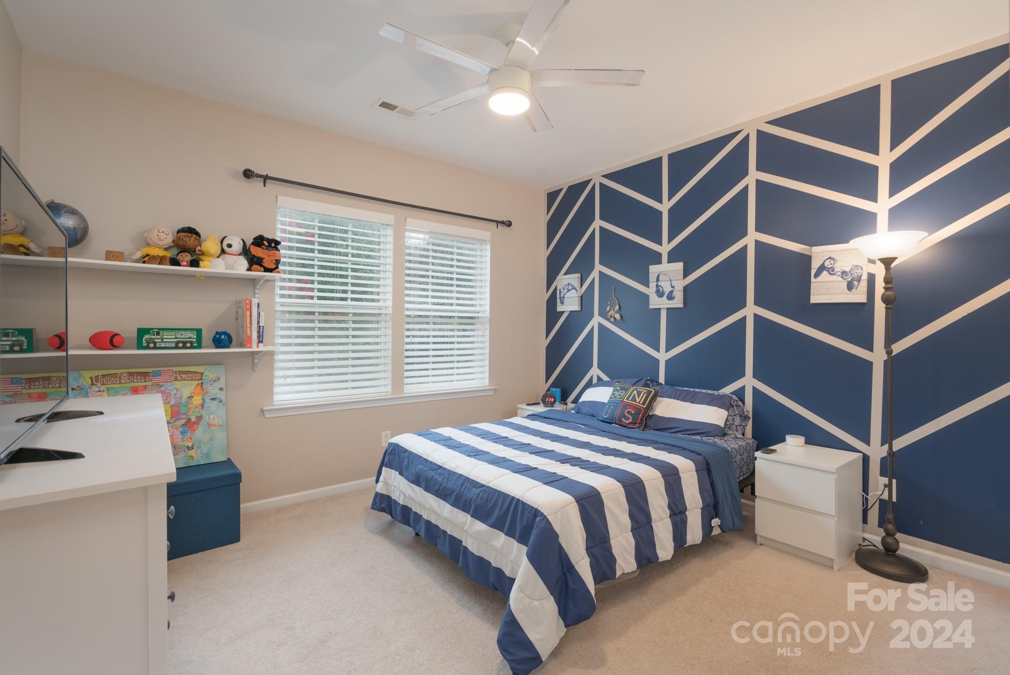 925 Treasure Court Fort Mill, SC 29708 - Photo 28 of 45 a bedroom with a bed and a window