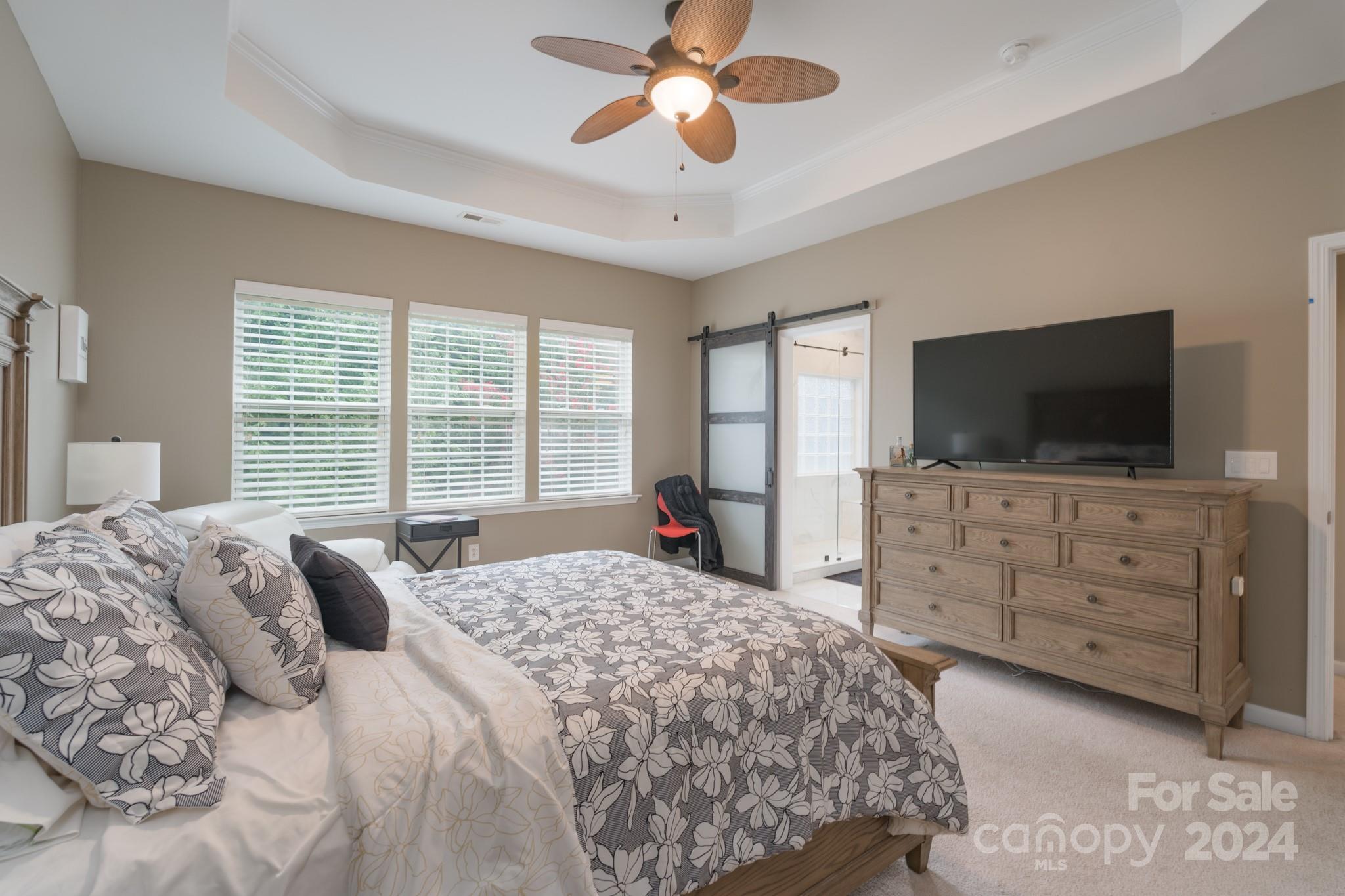 925 Treasure Court Fort Mill, SC 29708 - Photo 30 of 45 a bedroom with a bed and a flat screen tv