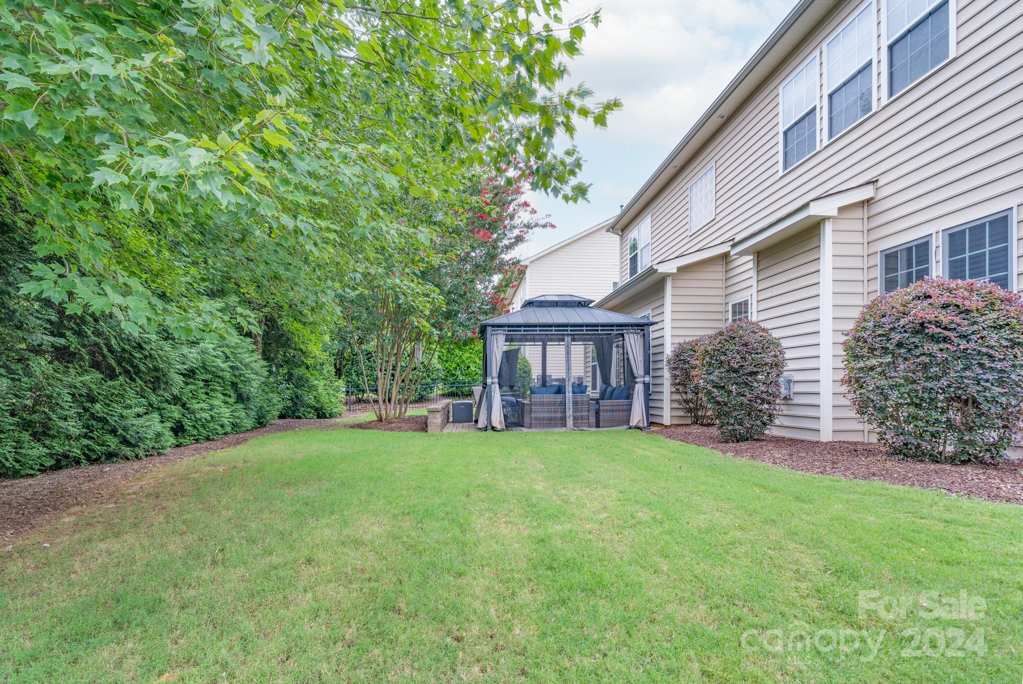 925 Treasure Court Fort Mill, SC 29708 - Photo 35 of 45 a view of a house with a yard and pathway