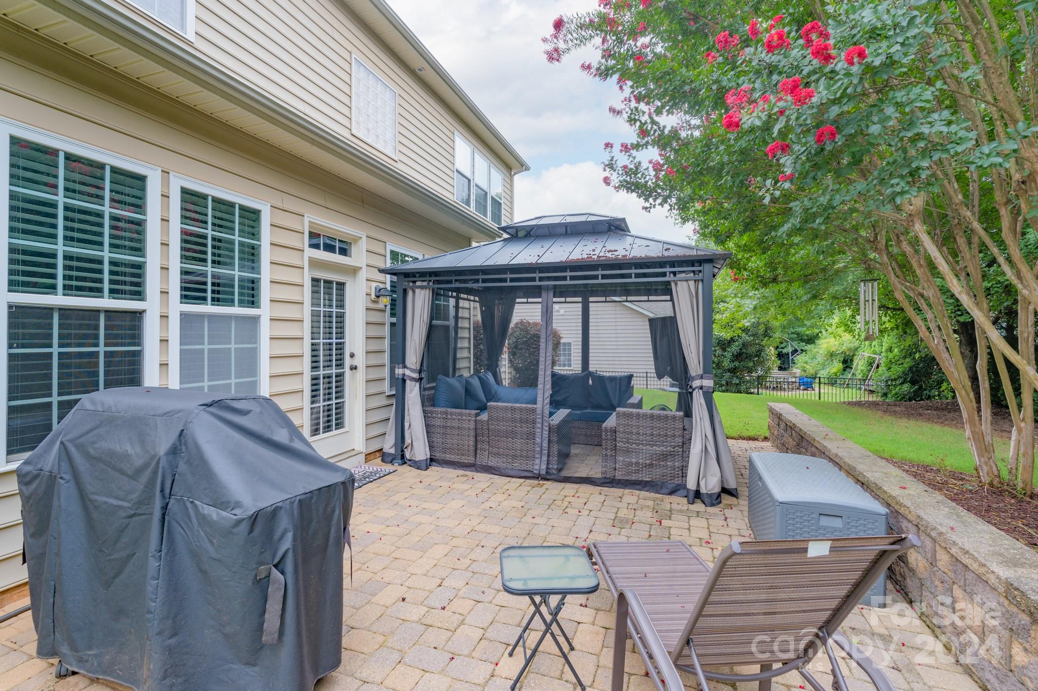 925 Treasure Court Fort Mill, SC 29708 - Photo 36 of 45 a house view with a seating space and garden view