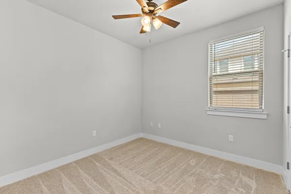 a kitchen with stainless steel appliances white cabinets and a stove top oven