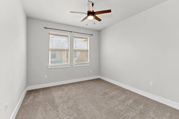 a view of staircase with white walls