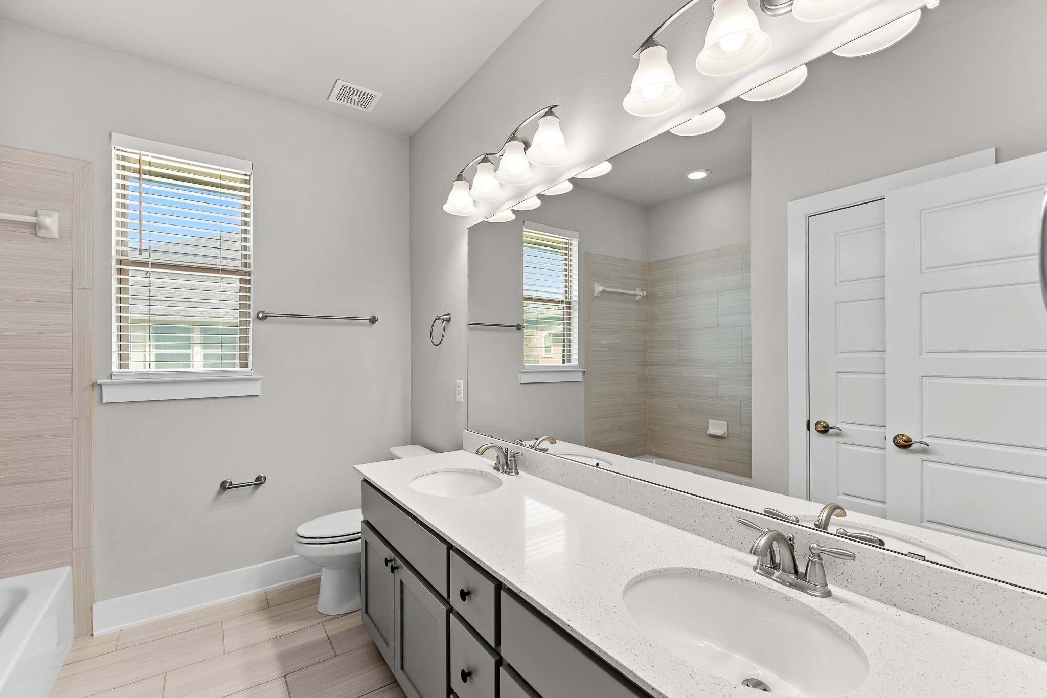 13800 Lyndhurst Street, Unit 211 Austin, TX 78717 - Photo 25 of 40 Full bath with double vanity and shower / tub combination