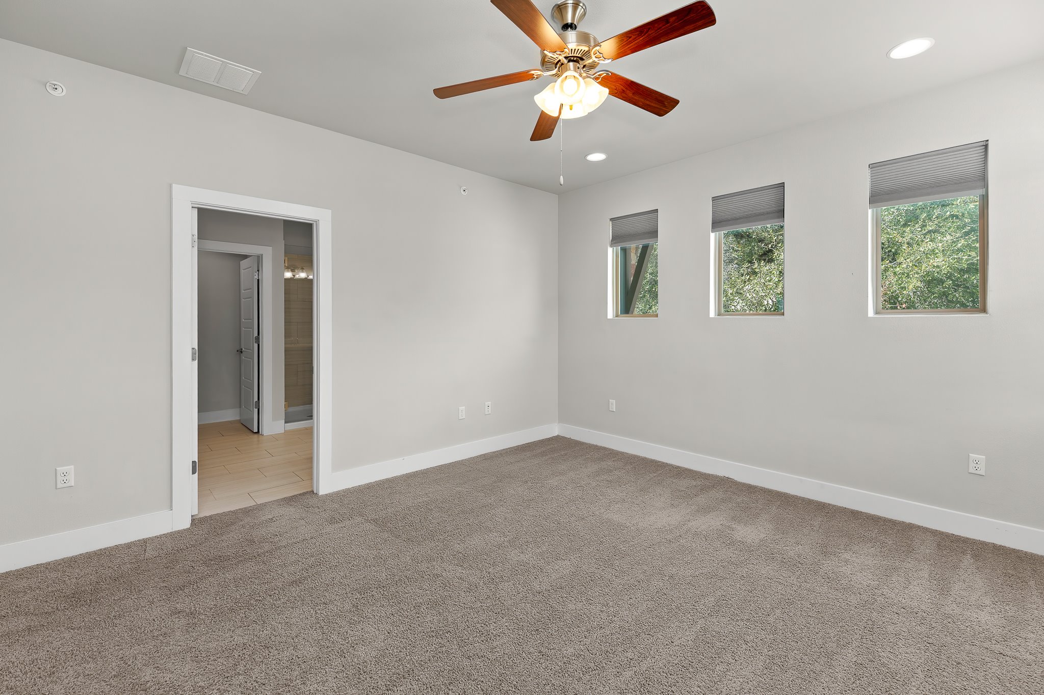 13800 Lyndhurst Street, Unit 211 Austin, TX 78717 - Photo 29 of 40 Ceiling fan, light colored carpet, and recessed lighting
