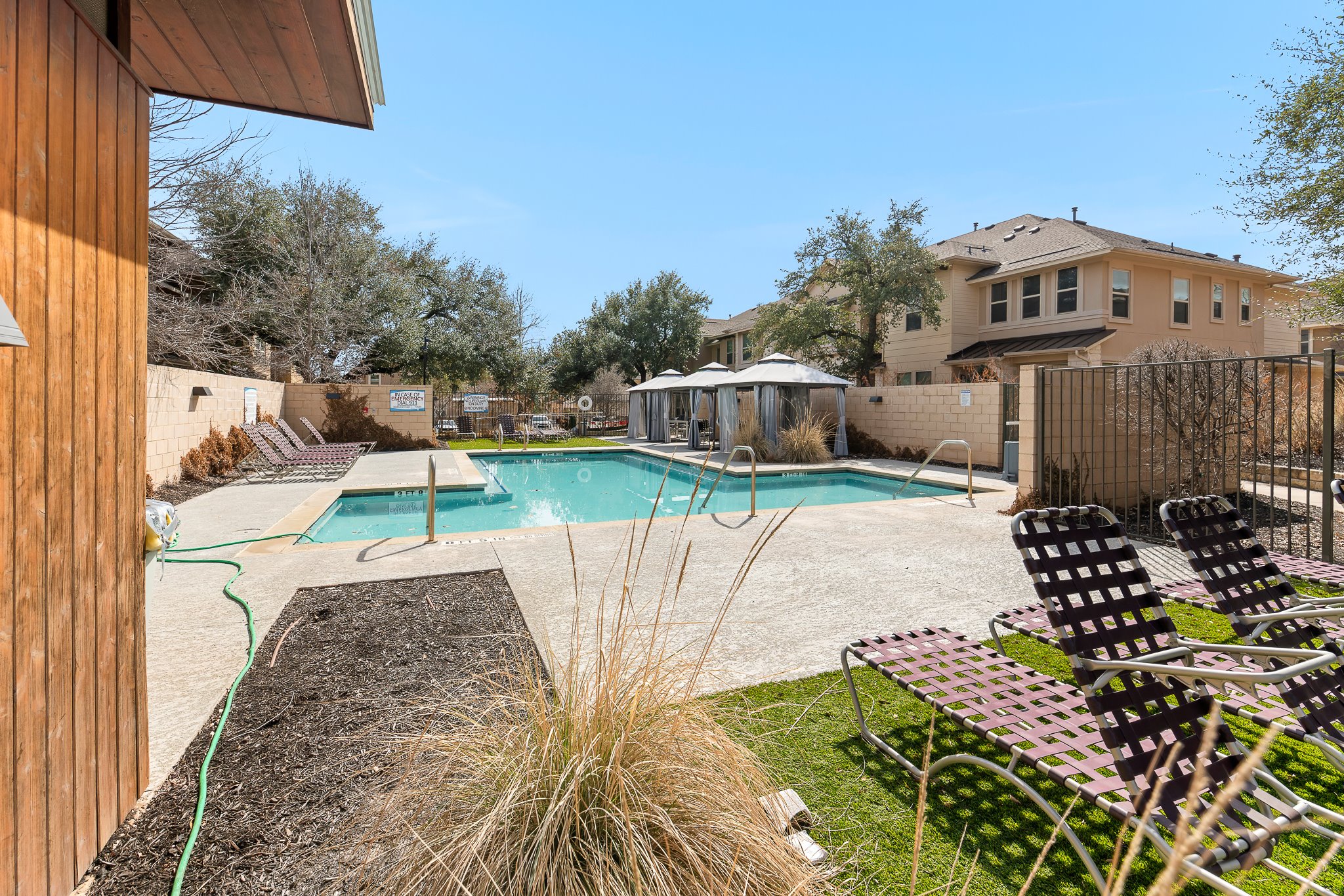 13800 Lyndhurst Street, Unit 211 Austin, TX 78717 - Photo 38 of 40 Community pool featuring a patio area, a fenced backyard, and a gazebo