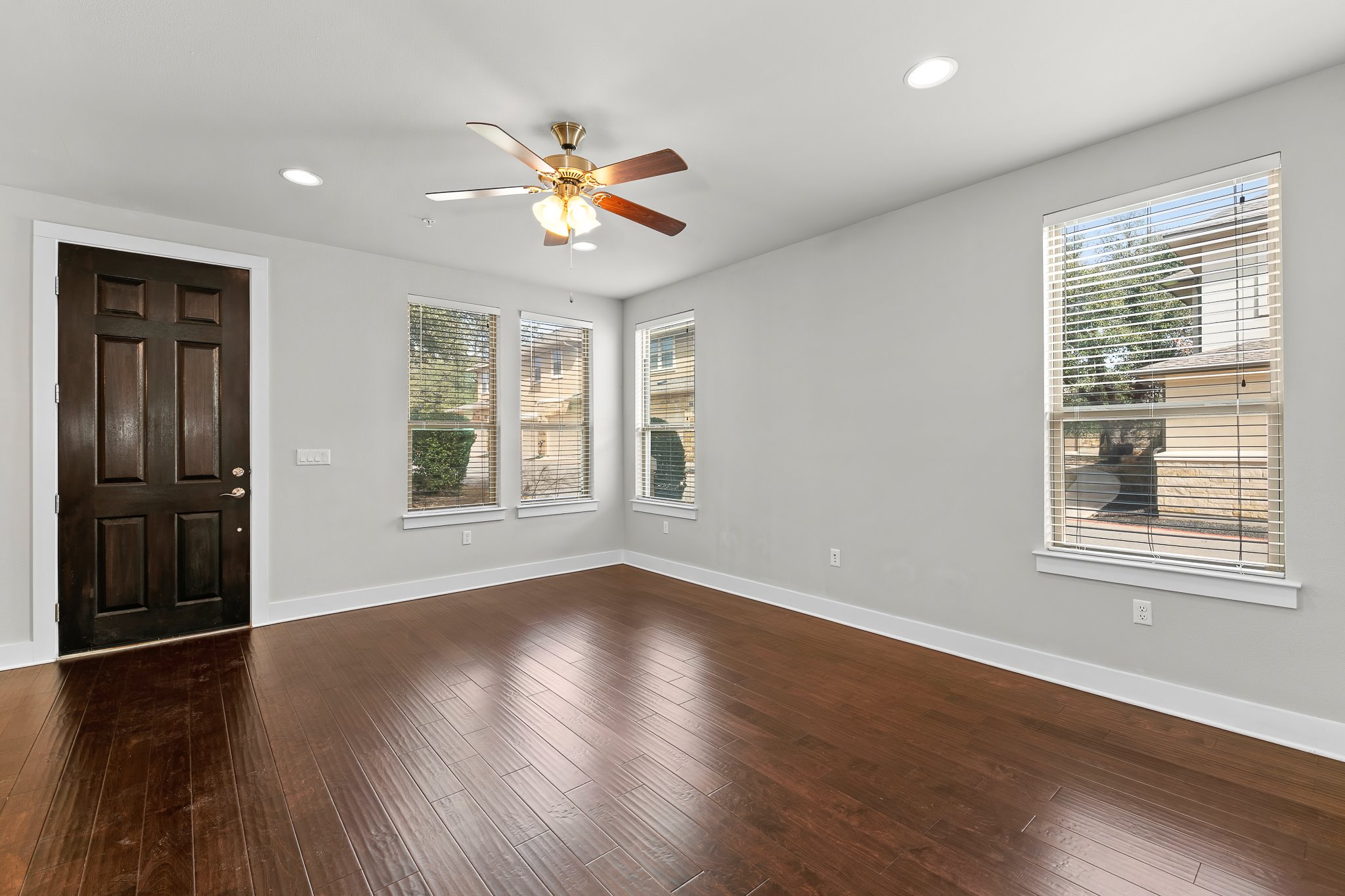 13800 Lyndhurst Street, Unit 211 Austin, TX 78717 - Photo 5 of 40 Ceiling fan, dark wood-style floors, and recessed lighting