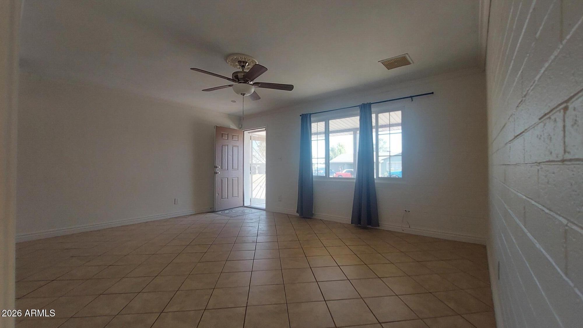 2448 West Freeway Lane Phoenix, AZ 85021 - Photo 4 of 27 a view of an empty room with a window