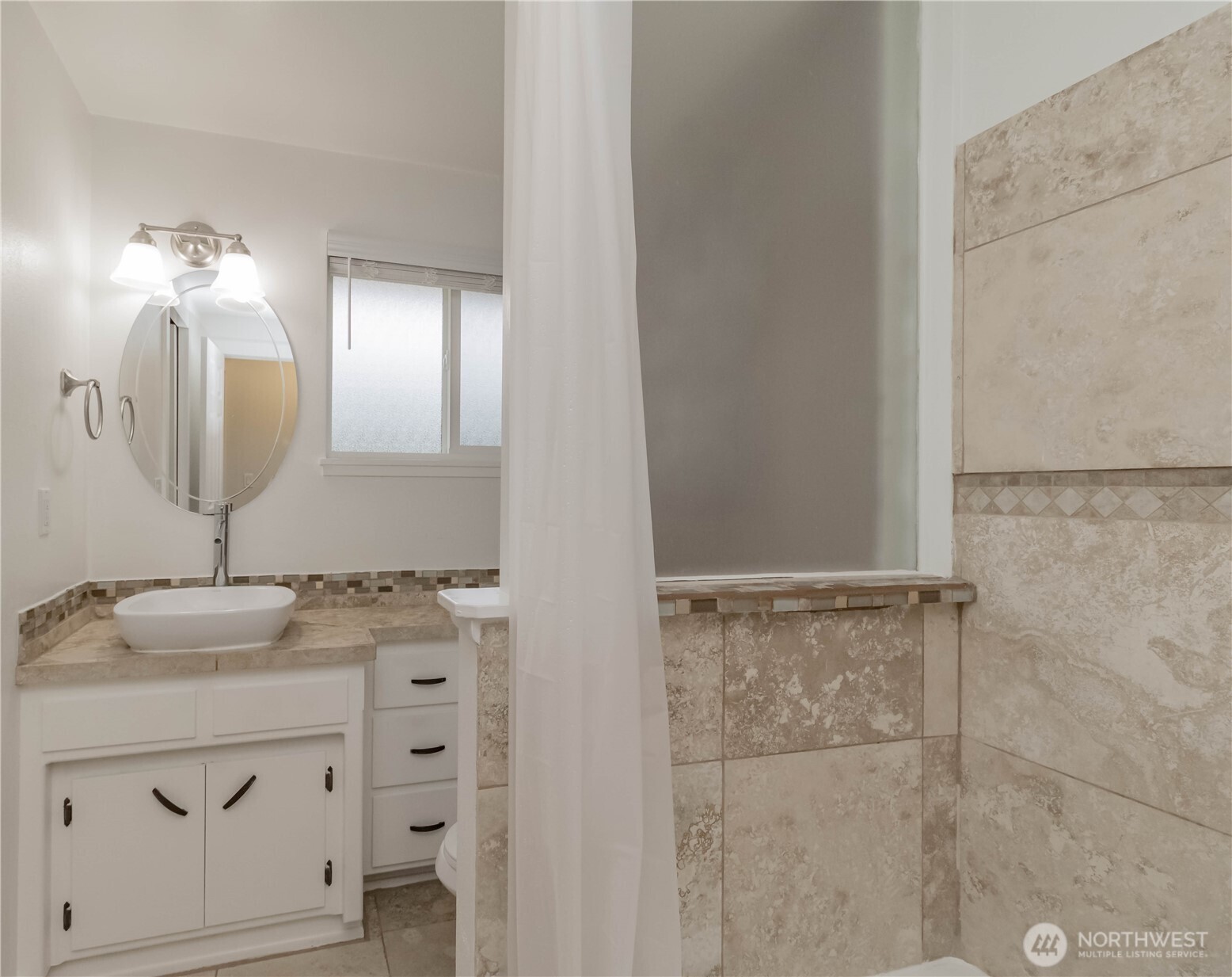 1060 Lynnwood Avenue Northeast Renton, WA 98056 - Photo 25 of 40 a bathroom with a sink vanity and mirror