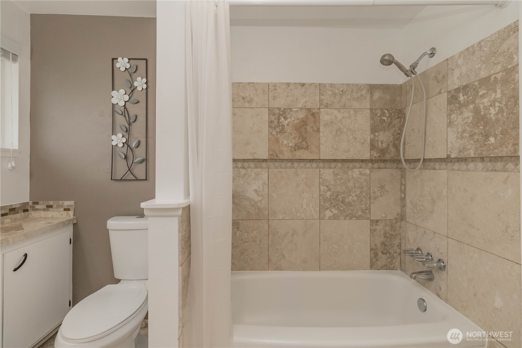 1060 Lynnwood Avenue Northeast Renton, WA 98056 - Photo 26 of 40 a bath room with a toilet a bath tub and shower