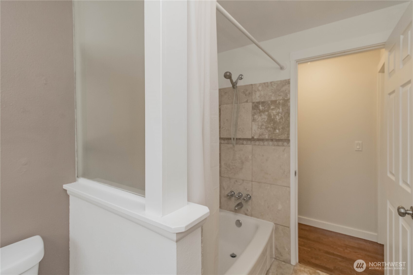 1060 Lynnwood Avenue Northeast Renton, WA 98056 - Photo 27 of 40 a bathroom with a bathtub and a shower