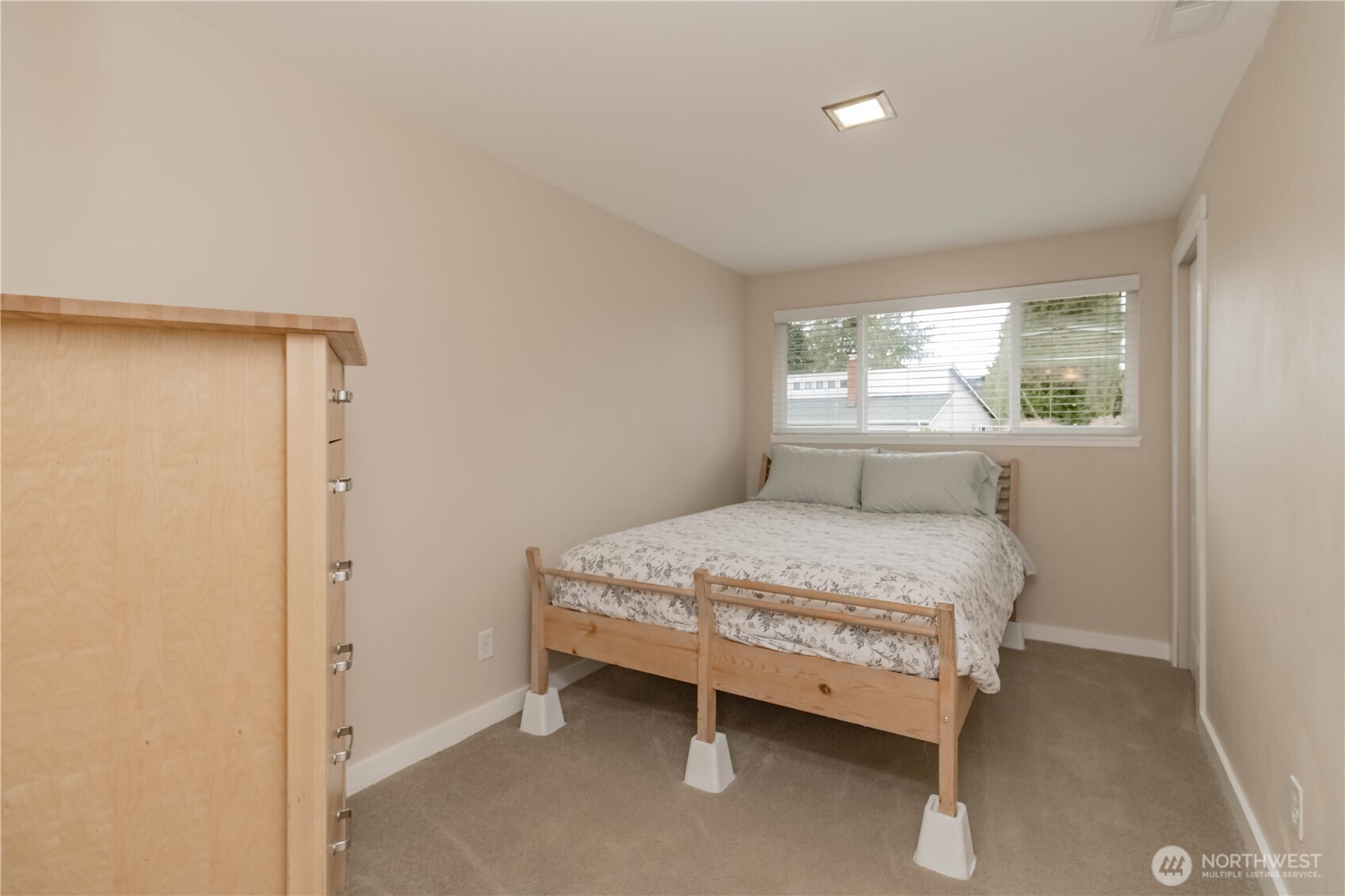 1060 Lynnwood Avenue Northeast Renton, WA 98056 - Photo 30 of 40 a bedroom with a bed and window