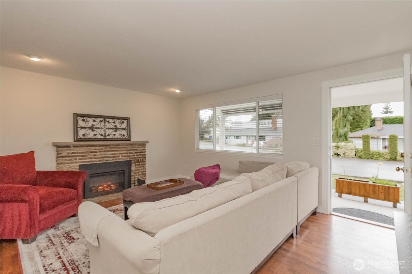 1060 Lynnwood Avenue Northeast Renton, WA 98056 - Photo 4 of 40 a living room with furniture fireplace and a table