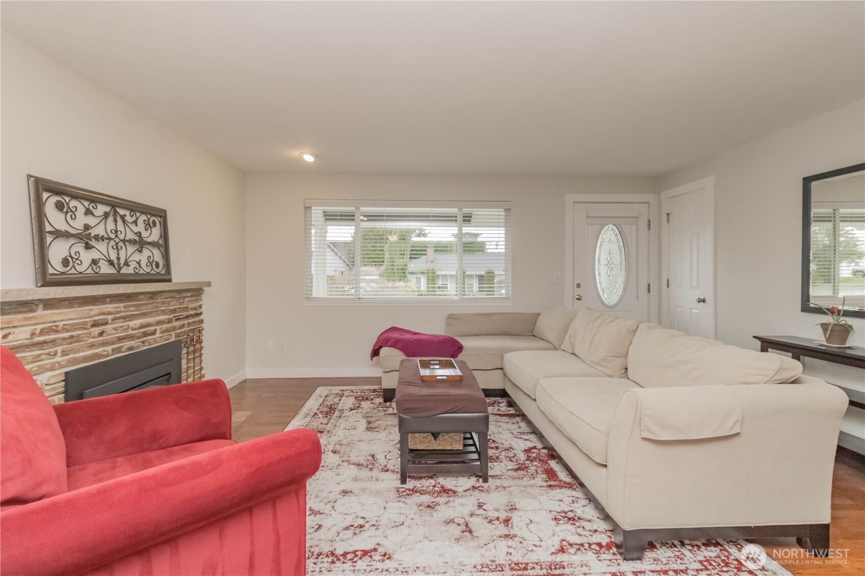 1060 Lynnwood Avenue Northeast Renton, WA 98056 - Photo 7 of 40 a living room with furniture and a fireplace