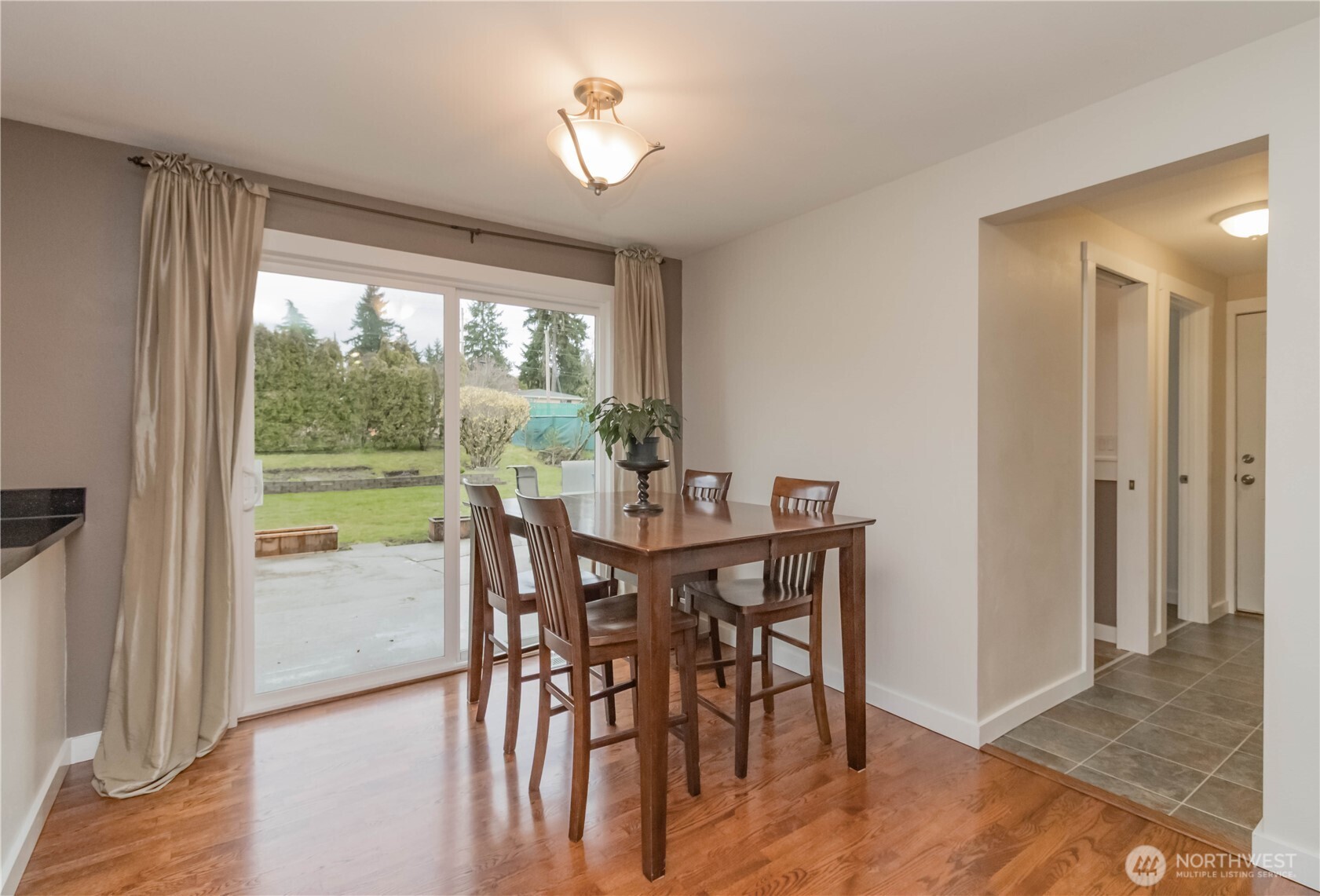 1060 Lynnwood Avenue Northeast Renton, WA 98056 - Photo 10 of 40 a view of a dining room with furniture window and outside view