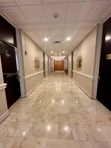 a room with gym equipment and a large window