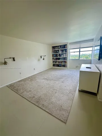 an aerial view of a house with a lake view