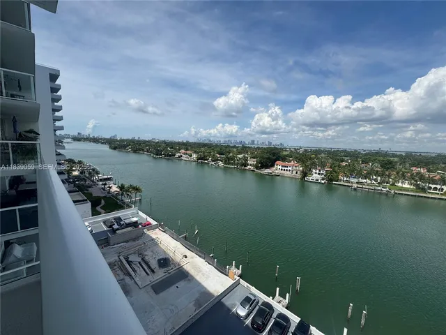 an aerial view of a house with a lake view