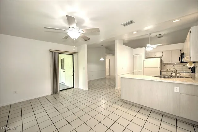 a bathroom with a sink vanity and a mirror