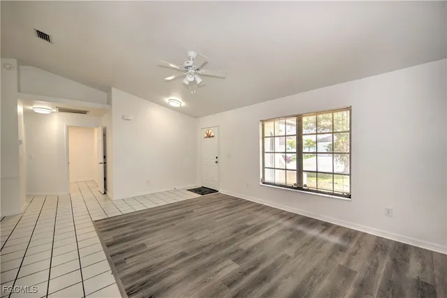 a view of an empty room with a window
