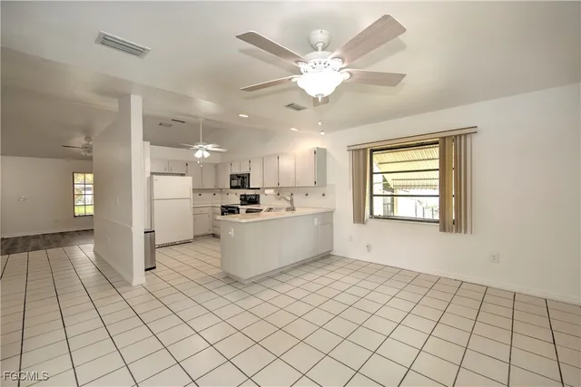 a view of kitchen with windows