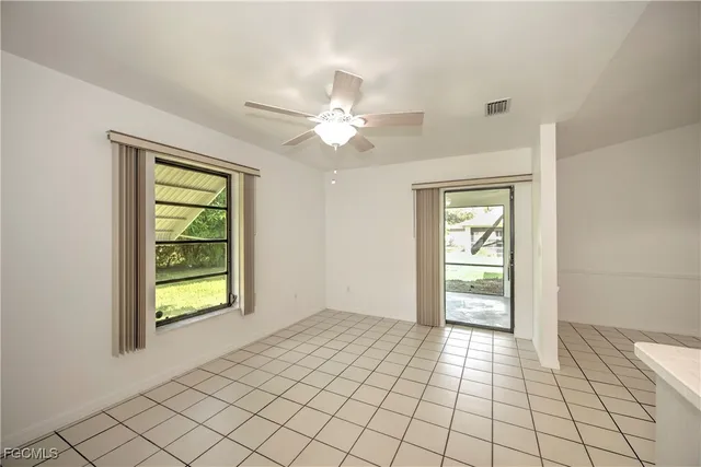 a view of an empty room with a window