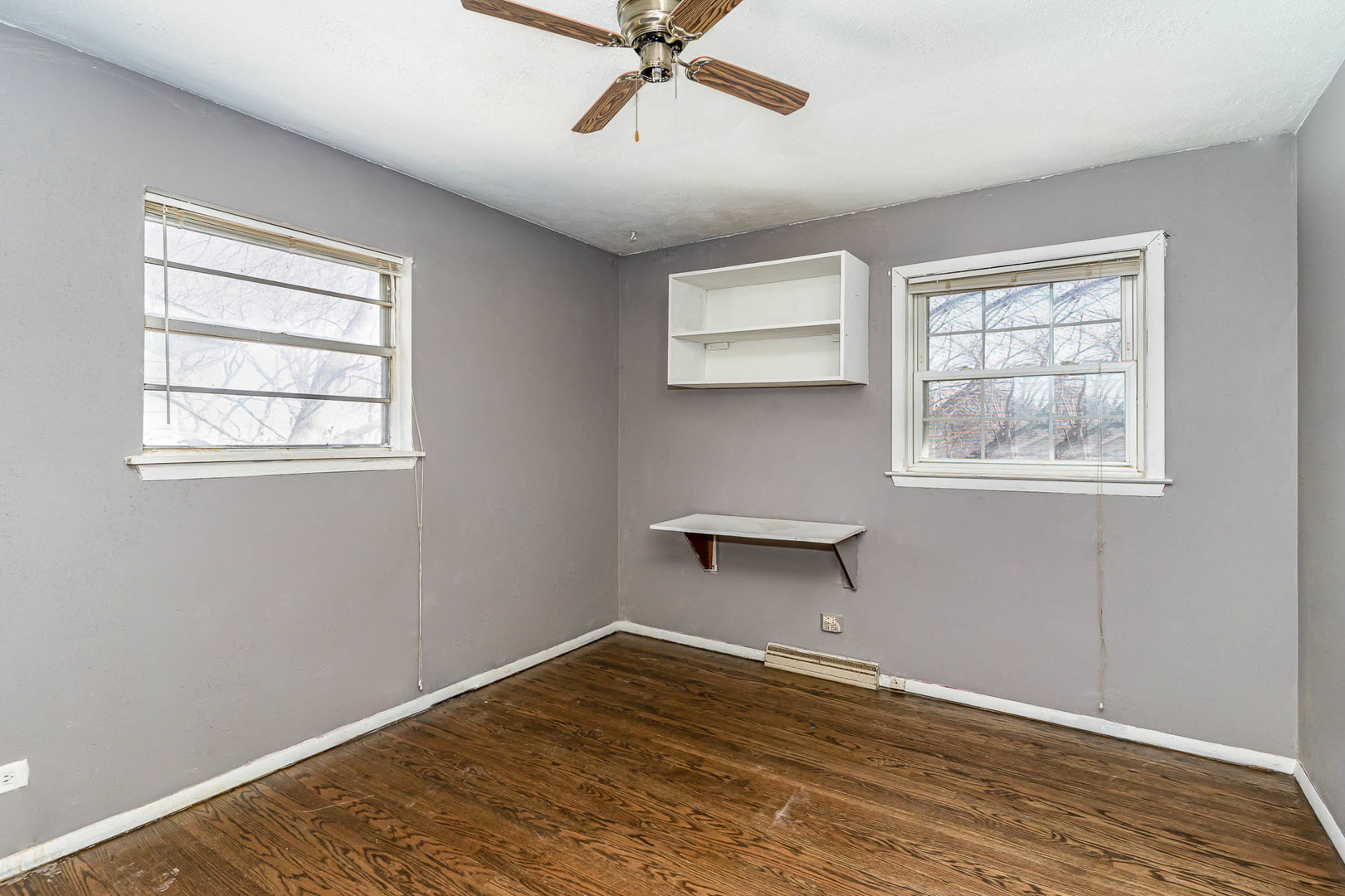 57 Tweed Road Fox Lake, IL 60020 - Photo 22 of 25 a view of a room with wooden floor and windows