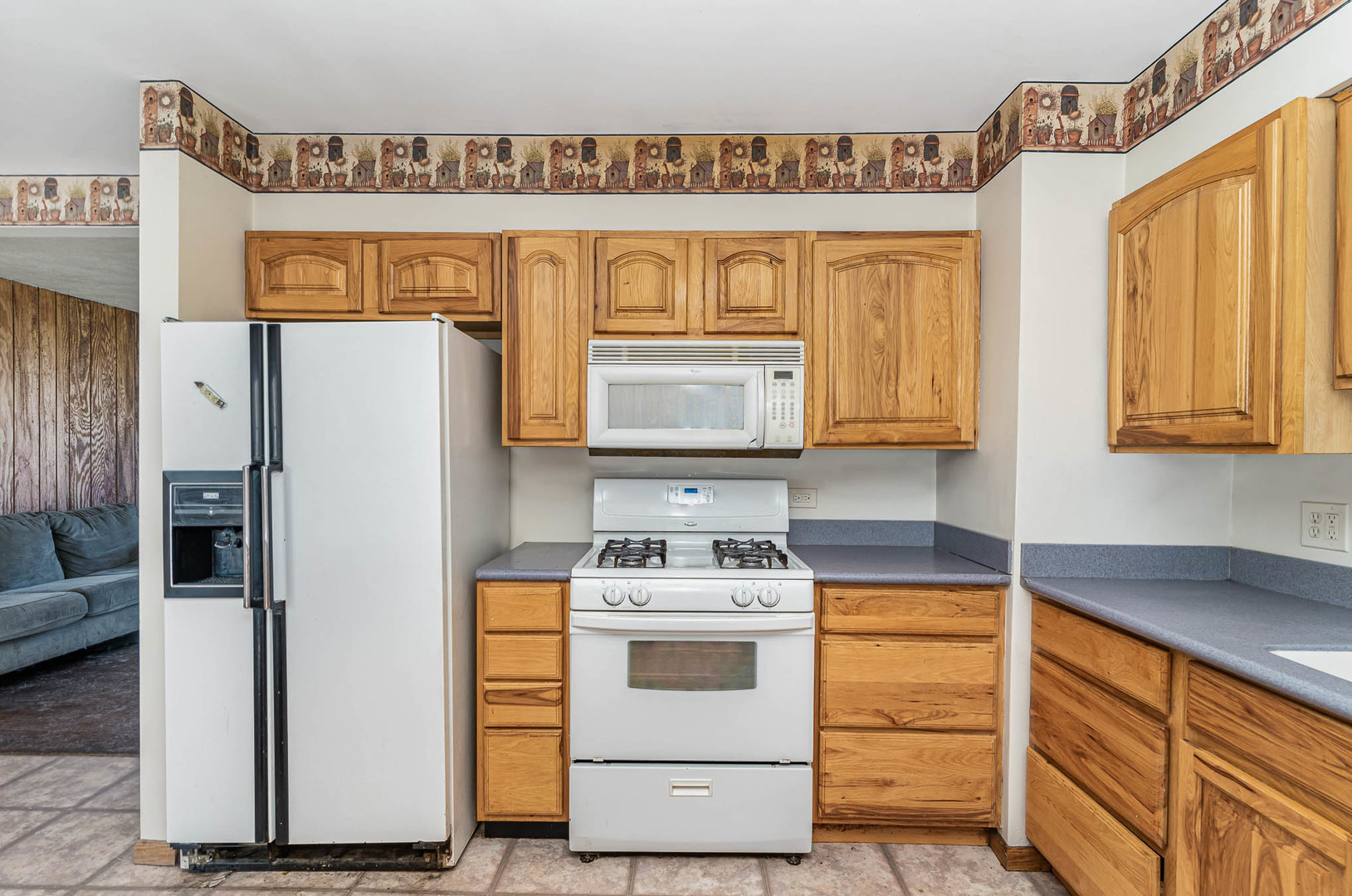 57 Tweed Road Fox Lake, IL 60020 - Photo 8 of 25 a kitchen with stainless steel appliances a refrigerator and a stove