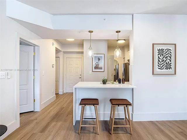 a view of kitchen with furniture and wooden floor