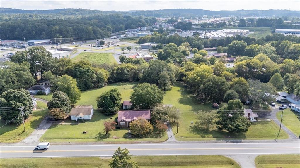 1316 Highway 41 Calhoun, GA 30701 - Photo 6 of 13 an aerial view of residential houses with outdoor space and lake view