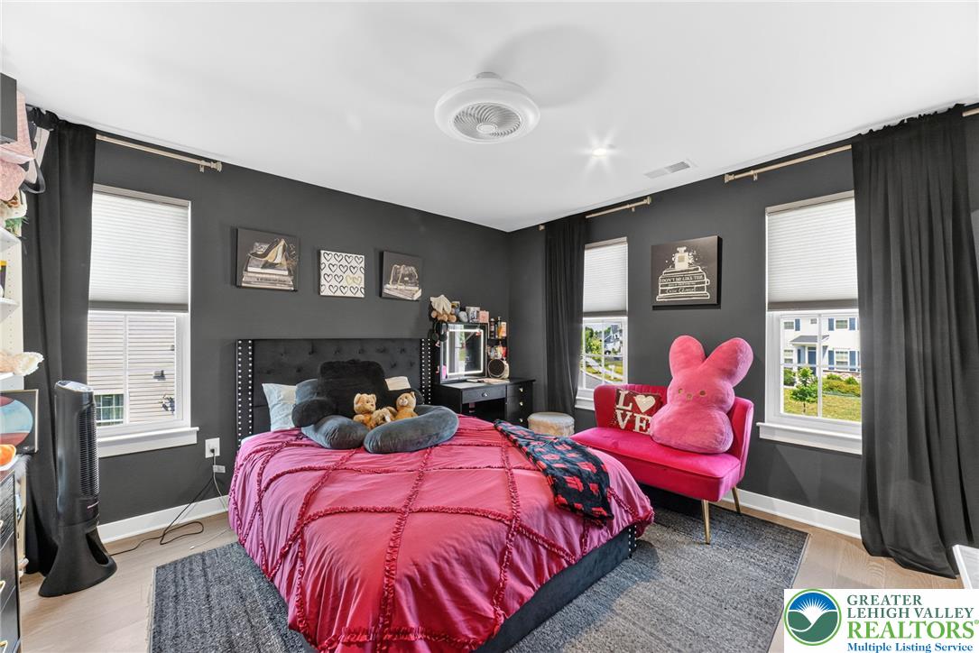 3952 Orth Street Bethlehem, PA 18020 - Photo 33 of 60 Well-lit and spacious, this bedroom offers light hardwood floors with multiple windows.