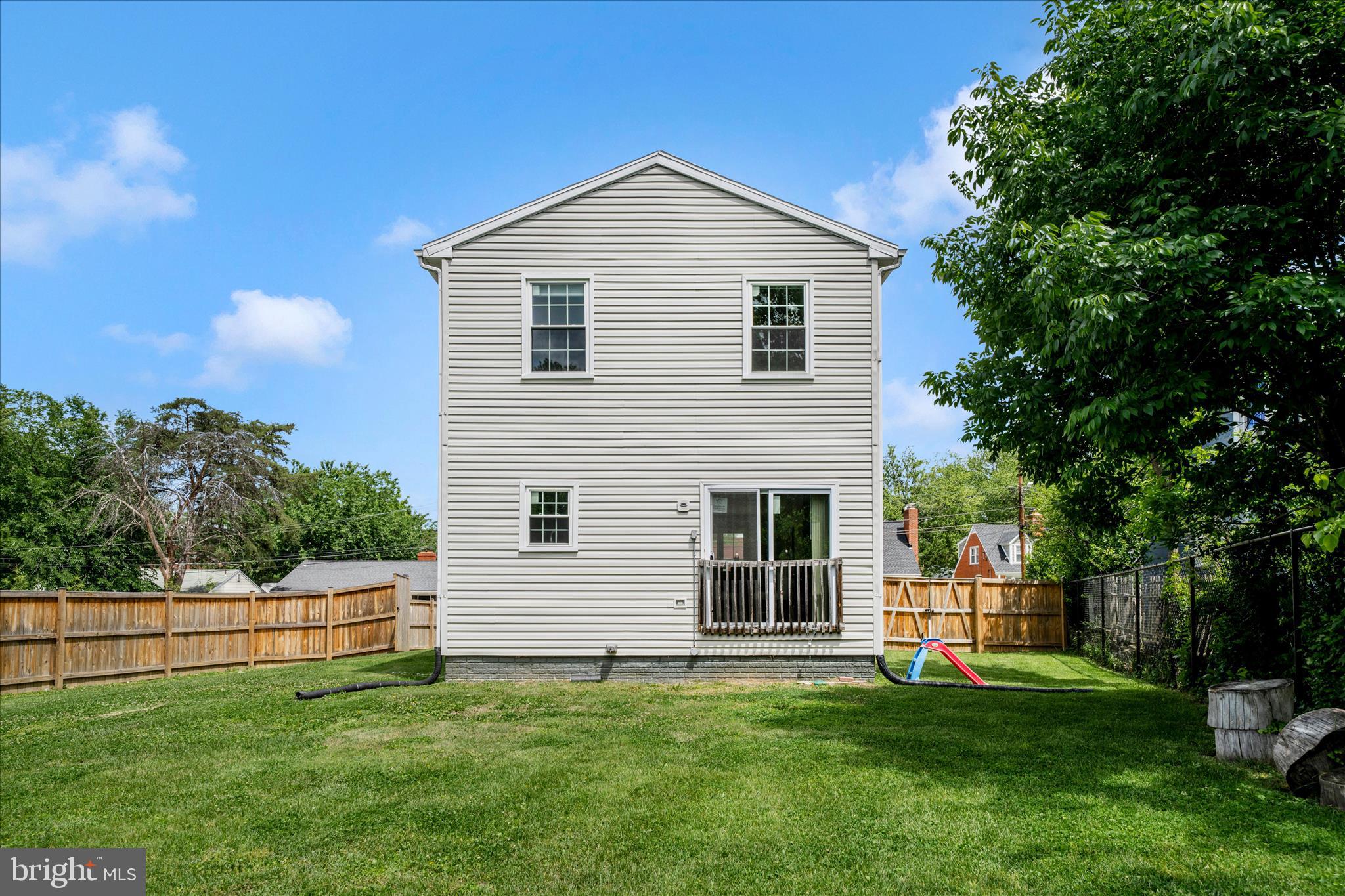 713 Seek Lane Silver Spring, MD 20912 - Photo 46 of 60 a front view of a house with a yard