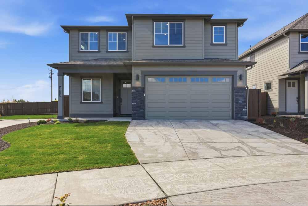 3923 Northeast Oakside Loop Bend, OR 97701 - Photo 1 of 21 a front view of a house with a yard