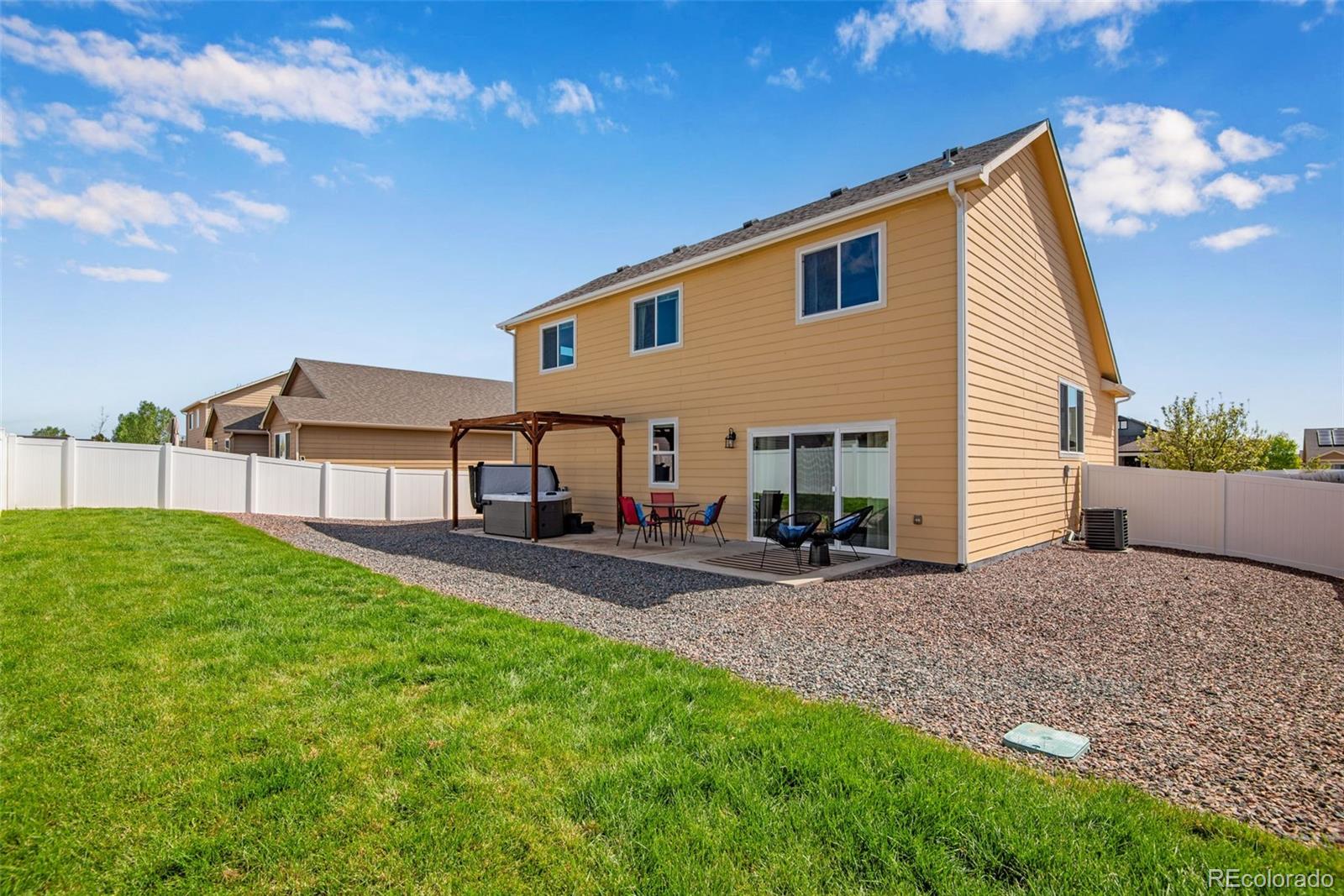 7035 McClellan Road Wellington, CO 80549 - Photo 6 of 43 a view of a house with backyard and a tree