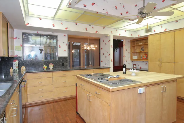 a kitchen that has a cabinets and a stove