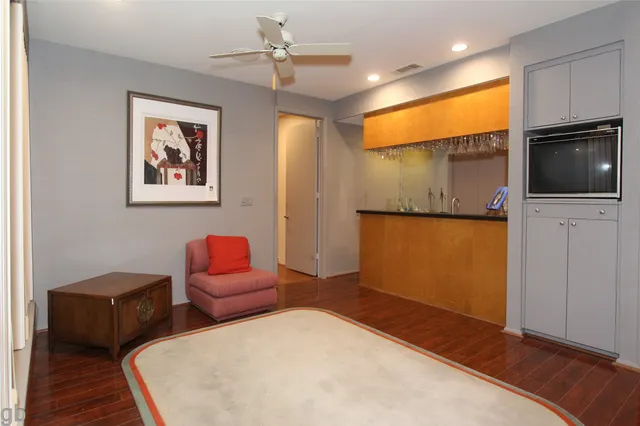 a bedroom with furniture and a flat screen tv