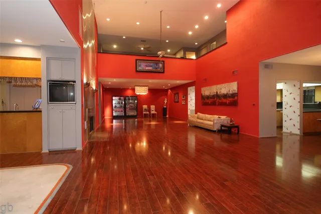 a lobby with furniture and wooden floor