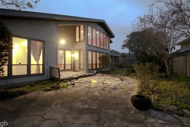 a view of a yard with a tree