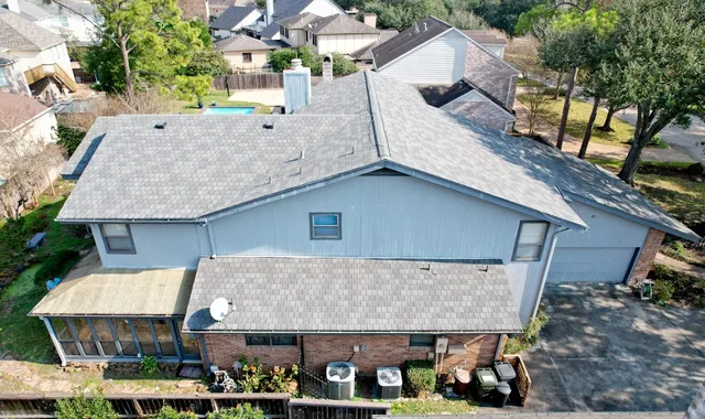 an aerial view of residential houses with outdoor space