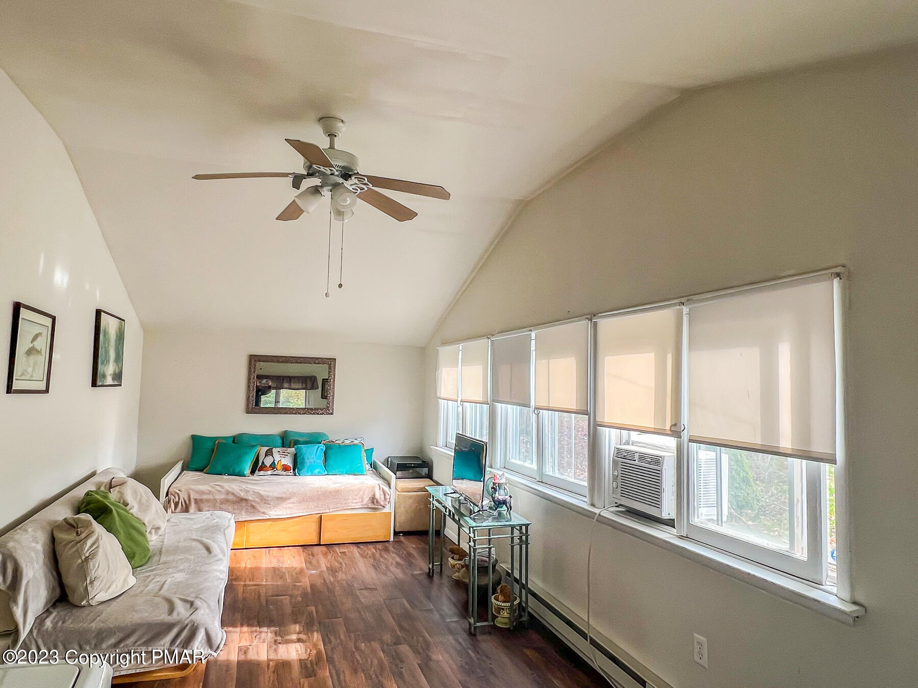 216 Sutton Place Pocono Summit, PA 18346 - Photo 2 of 34 a living room with furniture ceiling fan and a window
