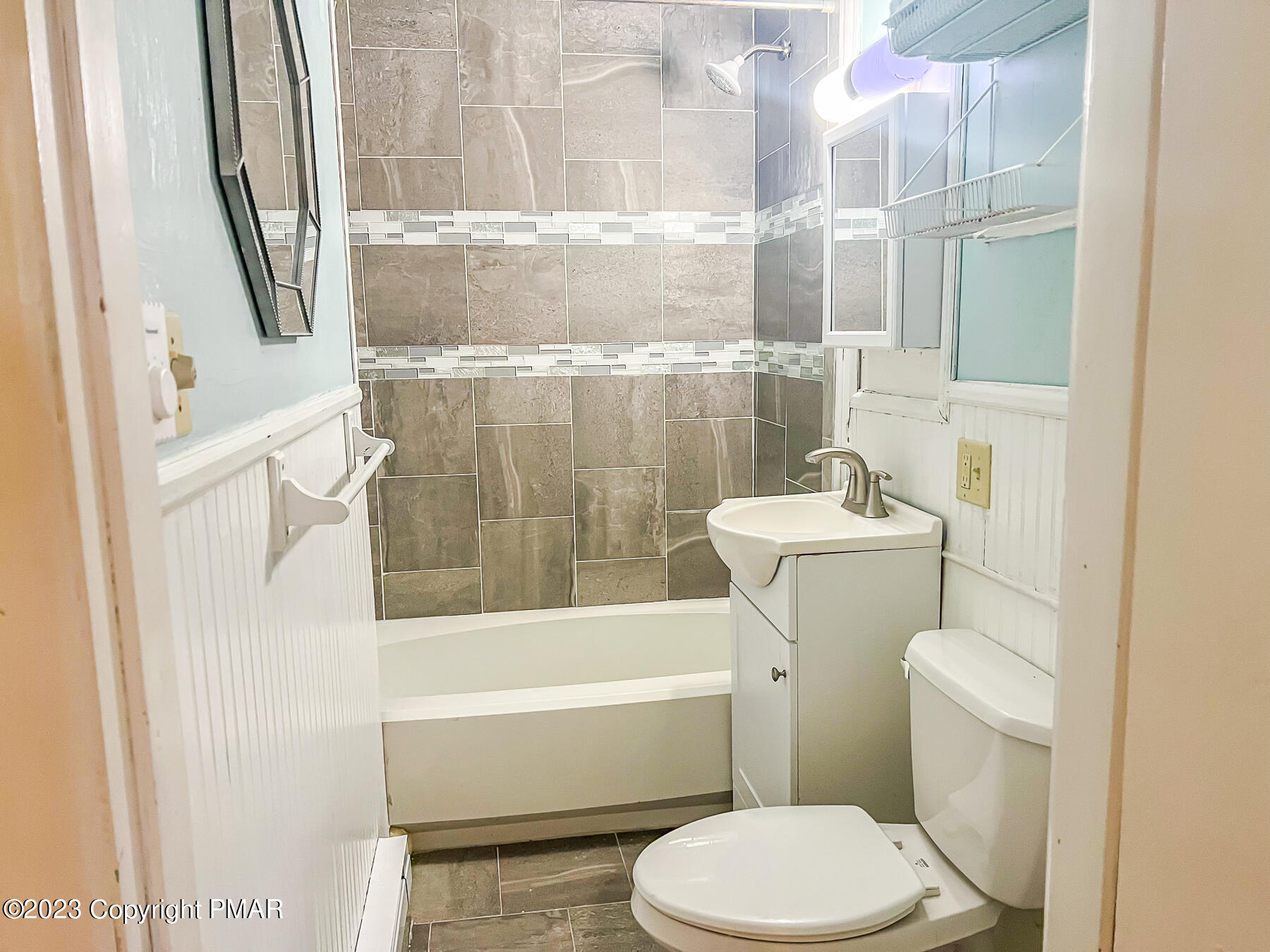 216 Sutton Place Pocono Summit, PA 18346 - Photo 22 of 34 a bathroom with a sink and a toilet