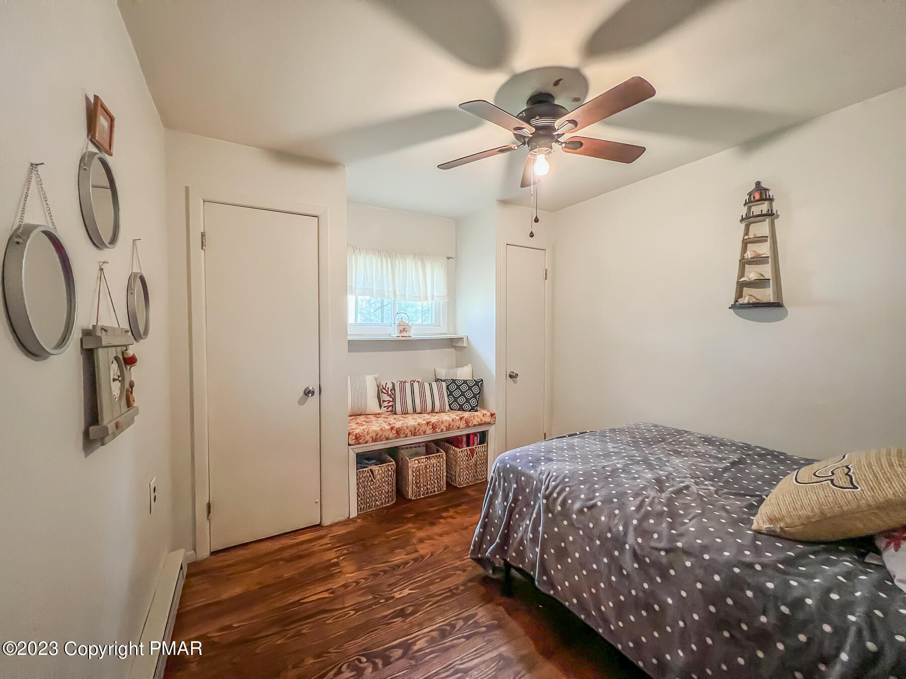 216 Sutton Place Pocono Summit, PA 18346 - Photo 24 of 34 a bedroom with a bed and a chandelier