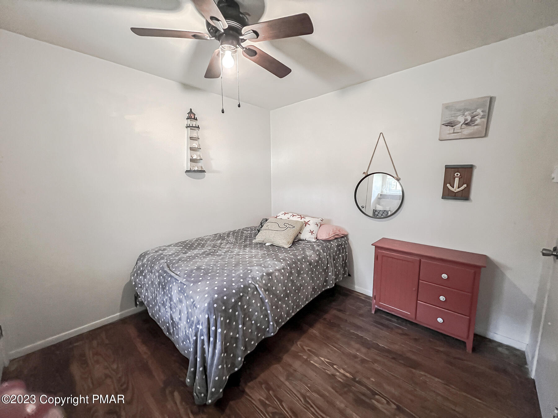 216 Sutton Place Pocono Summit, PA 18346 - Photo 26 of 34 a bed room with a bed and dresser