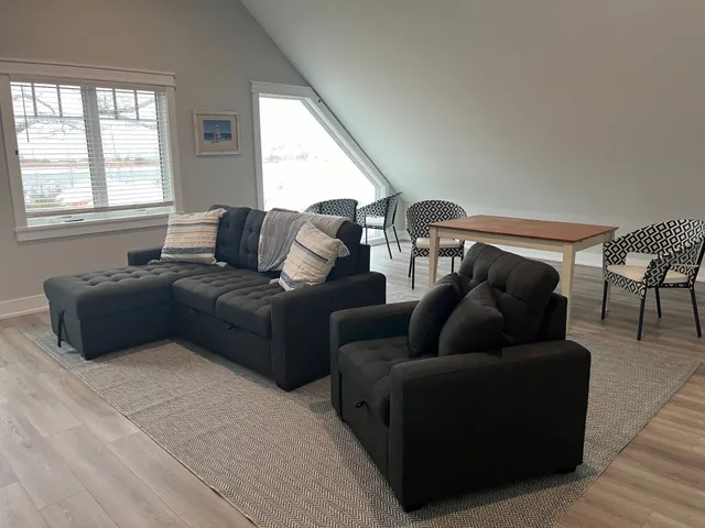 a living room with furniture and a window