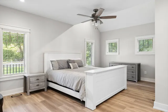 a bedroom with a bed and a dresser