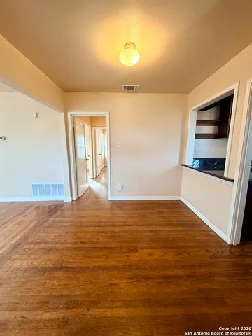 a view of an empty room and window