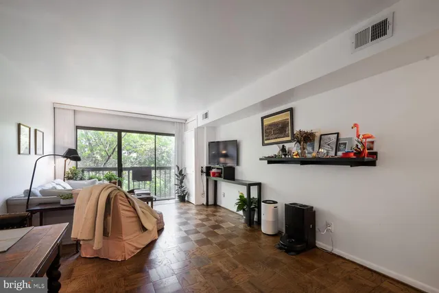 a living room with furniture fireplace and flat screen tv