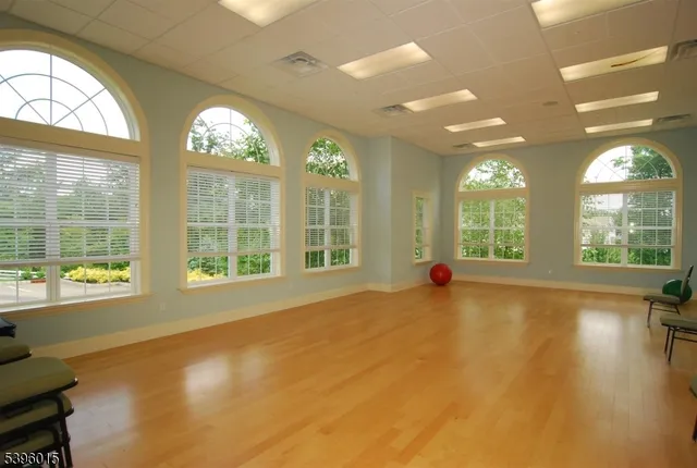 a dinning table and chairs in a living room