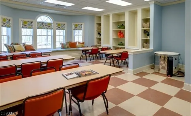 an aerial view of a house with a garden and lake view